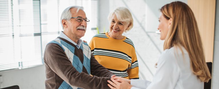 senior-couple-with-young-lady-doctor