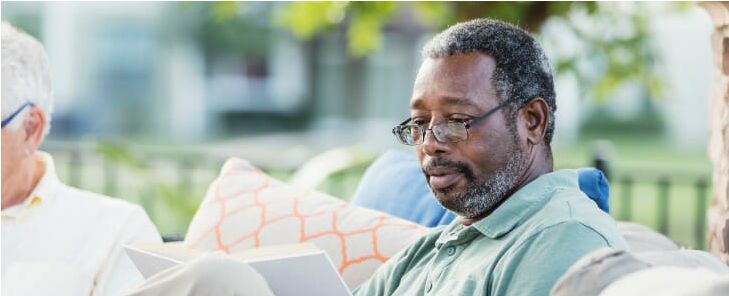 senior-reading-outdoors